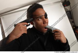 10 2018 01 GARSON STANDING POSE WITH GUNS SUICIDE